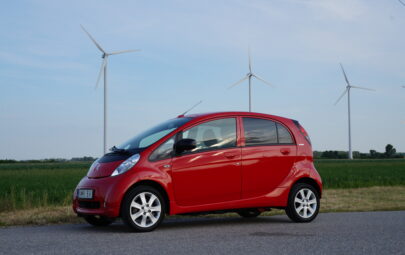 Peugeot iOn electric car with wind turbines (public domain)